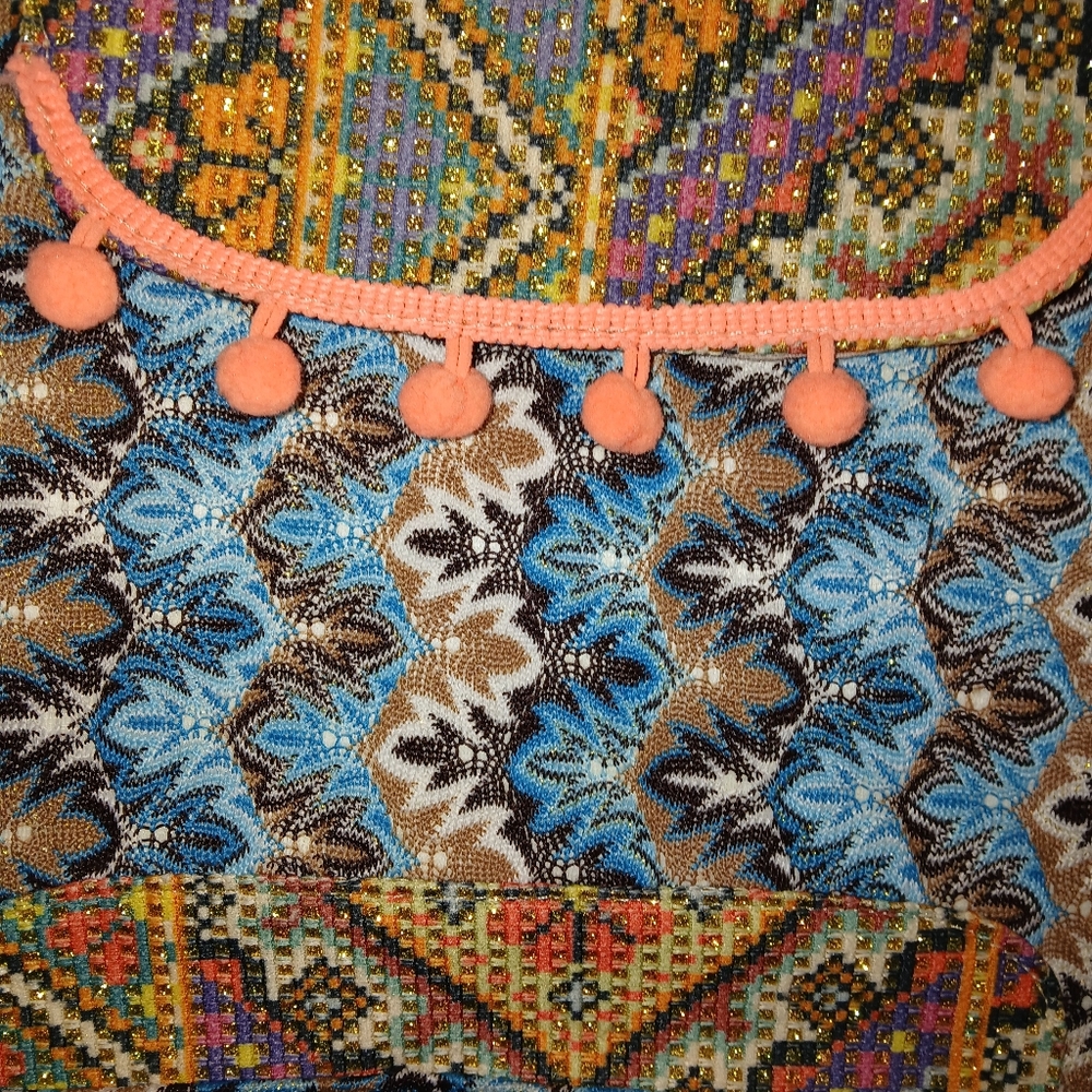 Colorful Patterned Textile with Pom Poms